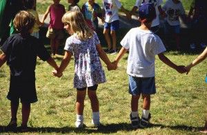 Inklusion Children Holding Hands on School Playground